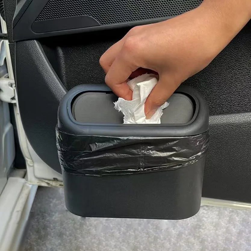 Car trash can with lid hanging in car