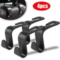 Car headrest hooks holding bags on seat back
