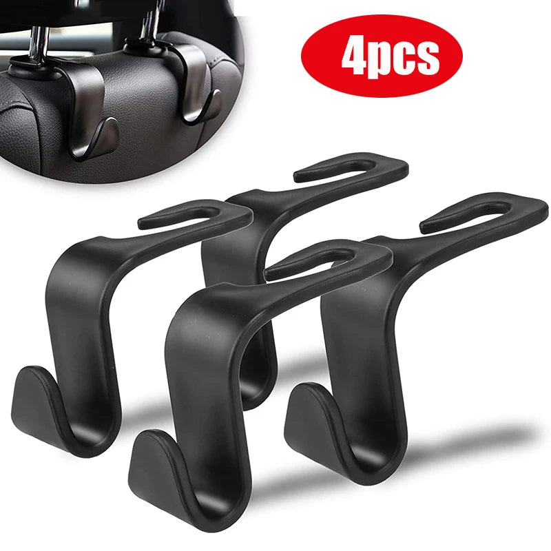 Car headrest hooks holding bags on seat back